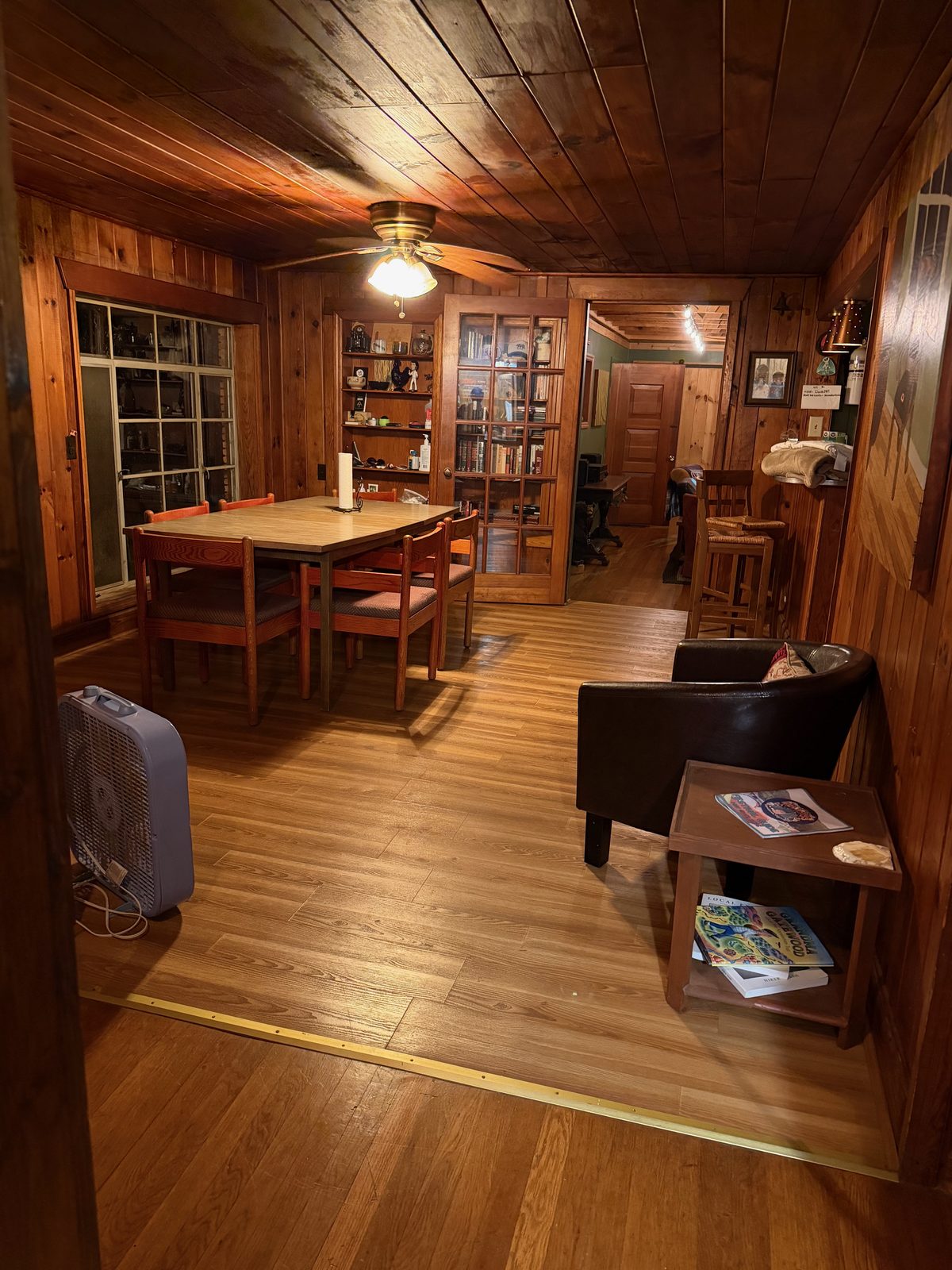 The warm wood-paneled dining room of the hostel