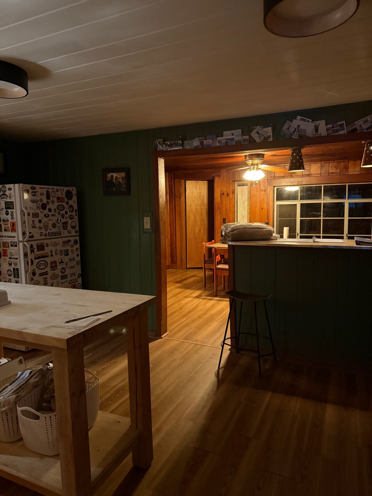 The hostel's kitchen and common area at night